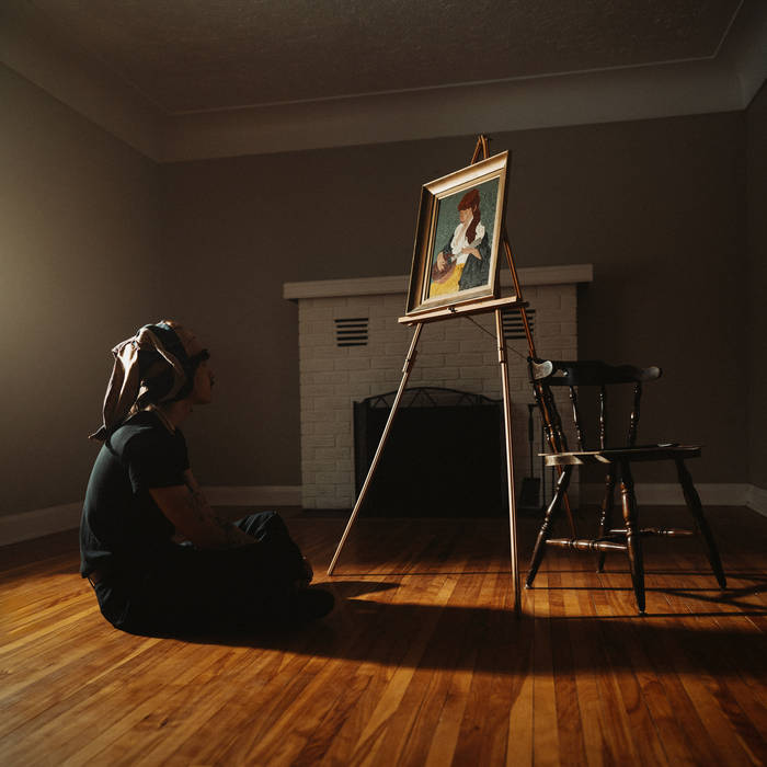 image is a photograph showing a person sitting on the floor looking up at a painting